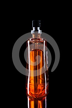 Perfume bottle isolated on black