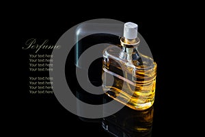 Perfume bottle isolated on black background with reflexion.