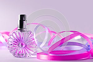 Perfume bottle on light background. Blank perfumery mockup, spa branding concept. Glamour fragrance, eau de parfum