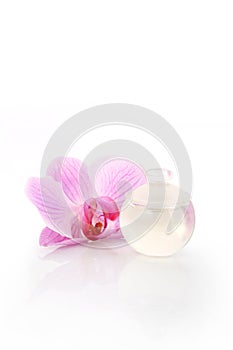 Perfume bottle and orchid flower