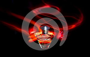 Perfume bottle and red light painting