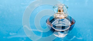 Perfume bottle under blue water, fresh sea coastal scent as glamour fragrance and eau de parfum product as holiday gift, luxury