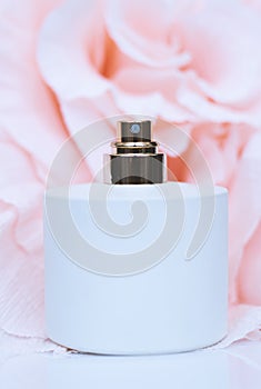 Perfume bottles with flowers on light background. Perfumery, cosmetics, fragrance collection