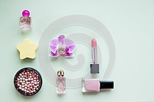 Perfume bottles with flowers on light background. Perfumery, cosmetics, fragrance collection. Woman`s glamour makeup
