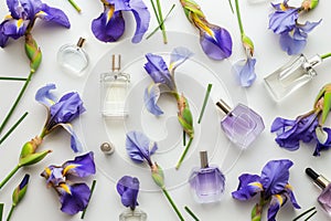 perfume bottles interspersed with iris flowers