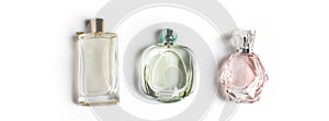 Perfume bottles on light background. Perfumery, cosmetics, fragrance collection. Banner for website.