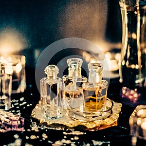 Perfume bottles and vintage fragrance at night, aroma scent, fragrant cosmetics and eau de toilette as luxury beauty brand,