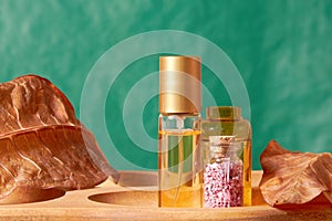 Perfume and cosmetics bottles set on the wooden natural table in the store