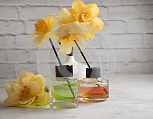 Perfume for home, flower  diffuser  on a light background