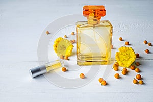 Perfume and perfume bottles with yellow flowers