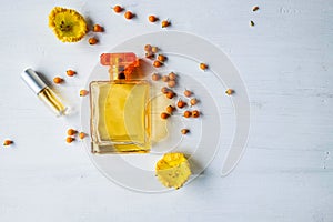 Perfume and perfume bottles with yellow flowers