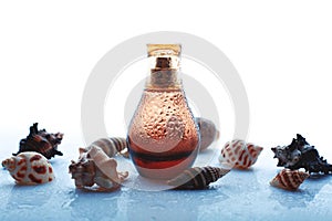 Perfume spray bottle with shells