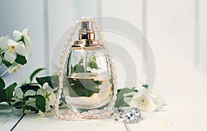 Perfume and string of pearls