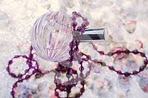 Perfume and string of pearls