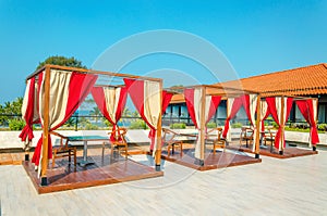 Pergolas with tables and chairs in restaurant