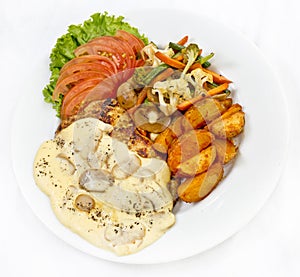Peri peri Chicken with Button mushroom gravy, Saute Vegetables, Spicy fried Potatoes with Tomato Lettuce Salad