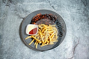 Peri Peri chicken with french fries served in plate isolated on background top view of baked food indian dessert