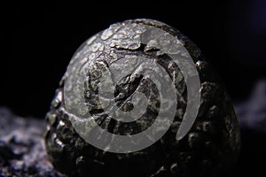 Periclase is a rare precious natural stone on a black background. AI generated. Header banner mockup with space.