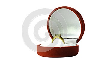 Peridot gold ring on red velvet box isolated on a white background, with clipping path,  For people born Leo