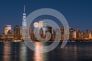 Perigee full moon over the skyscrapers of lower Manhattan-New Yo