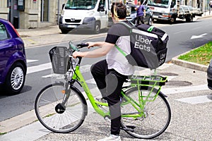 Ubereats bike delivery man with backpack Uber eats deliver restaurant to home or