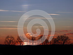 Perihelion sunset and sun pillar closeup