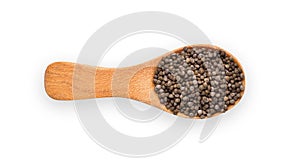 Perilla herb seed in wood spoon isolated on white background. Top view
