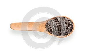 Perilla herb seed in wood spoon isolated on white background. top view