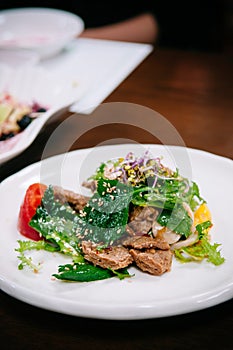 Perilla, Tul-kkae or beefsteak leaves salad with grilled pork Bu