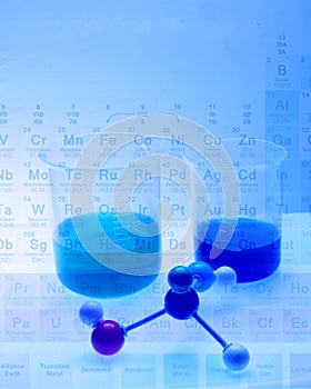 Periodic table of atomic elements with beakers and a molecular model.