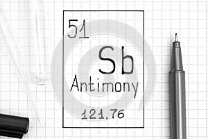 The Periodic table of elements. Handwriting chemical element Antimony Sb with black pen, test tube and pipette