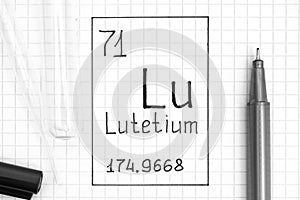 The Periodic table of elements. Handwriting chemical element Lutetium Lu with black pen, test tube and pipette