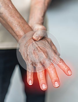 Peripheral Neuropathy pain in elderly patient on hand, palm, fingers and sensory nerves with numb, aching, muscle weakness photo