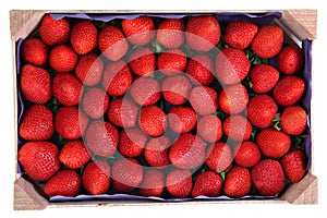 Perishable product, wooden tray with strawberries