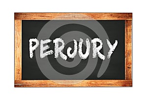 PERJURY text written on wooden frame school blackboard