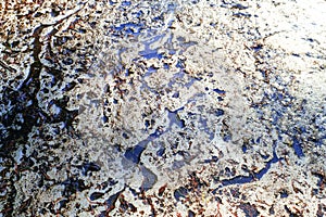 Permafrost. Melting ice in the Arctic in spring. Dirty ice. Ecological pollution. photo