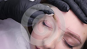 Permanent makeup procedure, performing PMU of eyebrows