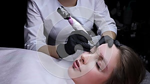 Permanent makeup procedure, performing PMU of eyebrows