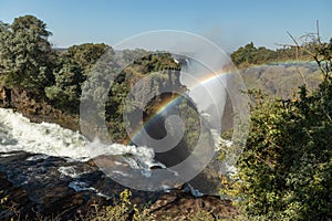 Permanent rainbow at Victoria Falls. Zimbabwe.