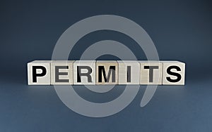 Permits. The cubes form the word Permits