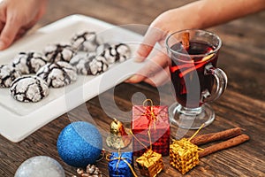 Perparing traditional cookies and gluhwein or mulled wine for new year celebration