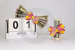 Perpetual calendar with wooden cubes. celebrating the birthday of the dollar on April 01