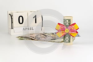 Perpetual calendar with wooden cubes. celebrating the birthday of the dollar on April 01.