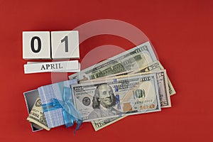 Perpetual calendar with wooden cubes. the concept of celebrating the birthday of the dollar on April 01