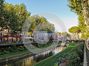 La Bassa river flowing through the city center of Perpignan, France