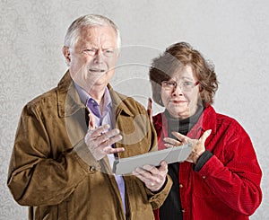 Perplexed Couple with Tablet