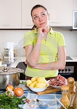 Perplexed woman with meat