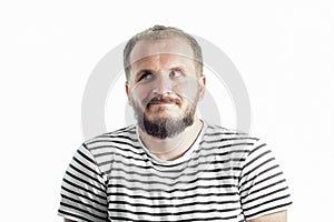 Perplexity bearded man in a striped T-shirt looking away. 30-35 years old. Isolated on white