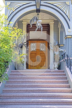 Perron stairs at the front of the porch with huge wooden double door at San Francisco, California