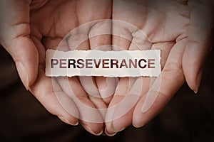 Perseverance text on hand